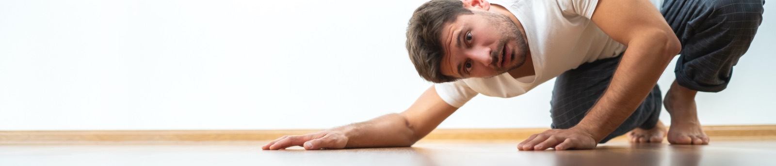 Man looking under the bed